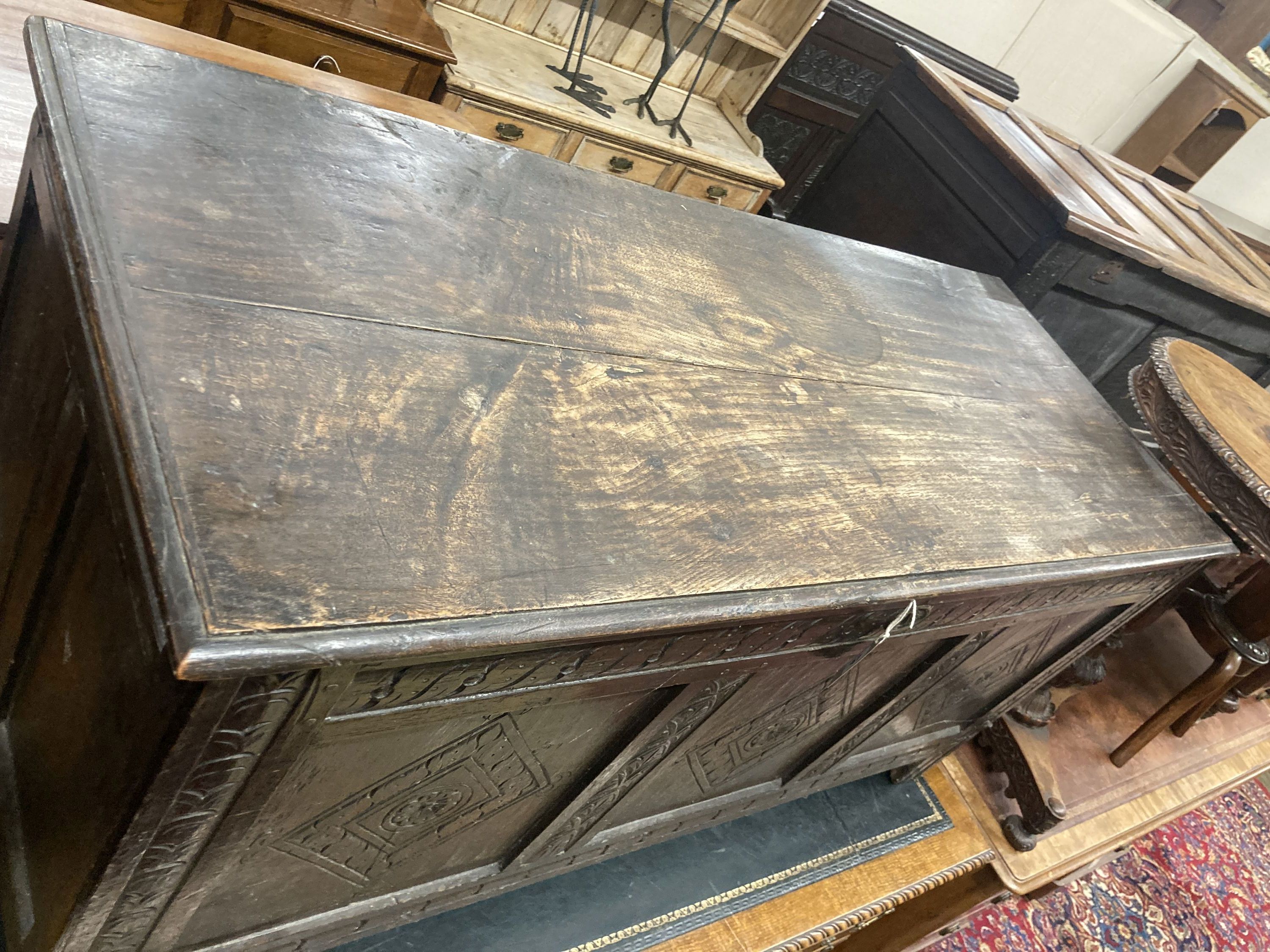 An early 18th century panelled oak coffer, length 134cm, depth 54cm, height 63cm